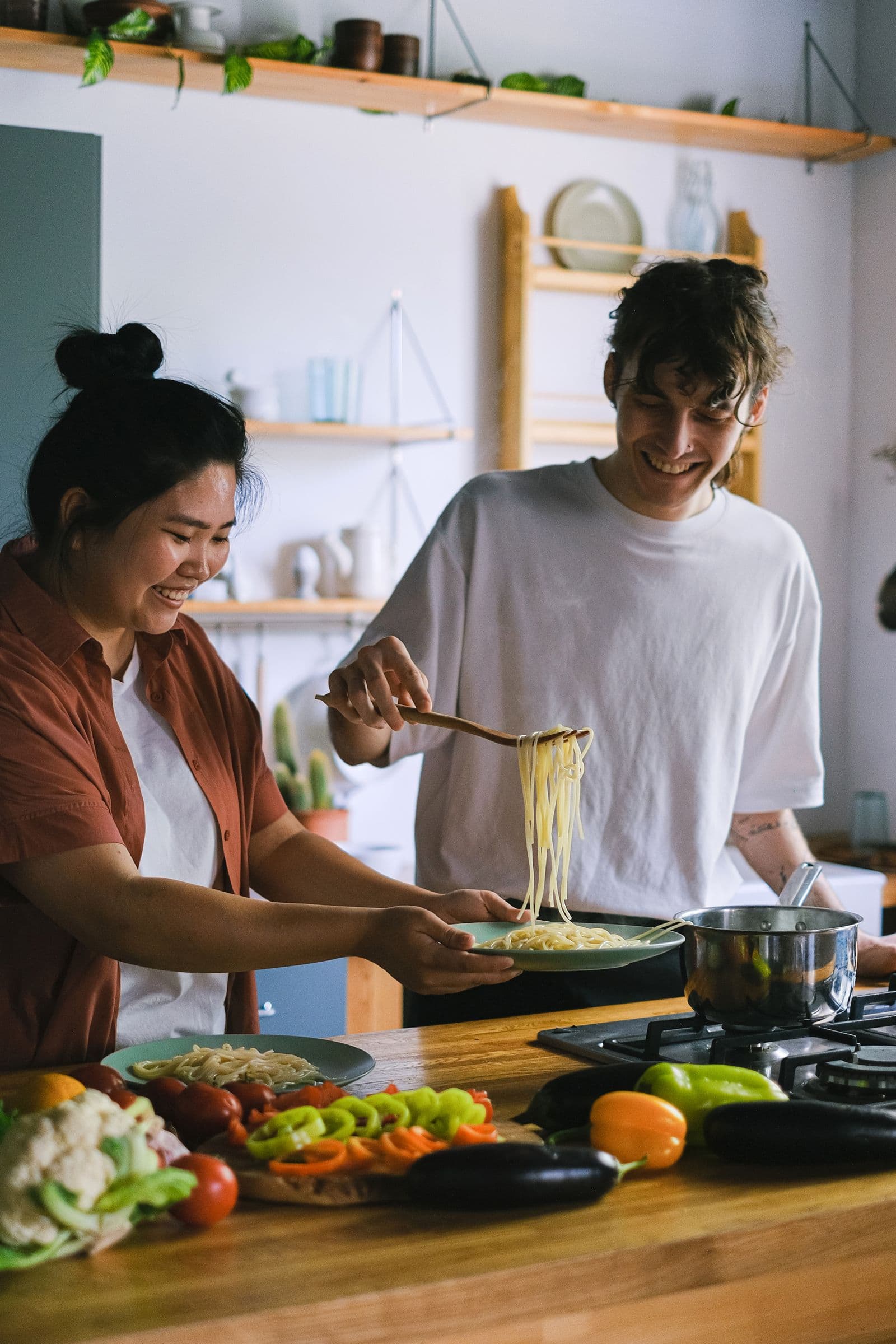 Two people preparing a meal together at home, building everyday independence